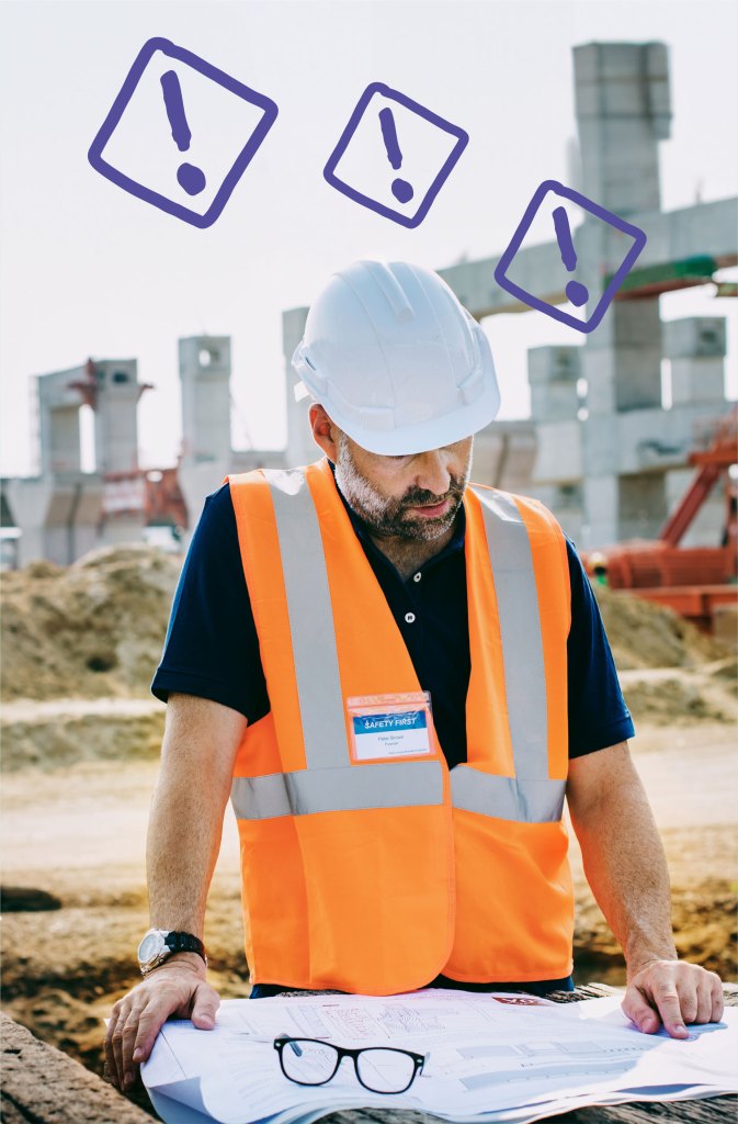 A construction worker looking at blueprints on a construction site with three exclamatory marks on top of head.